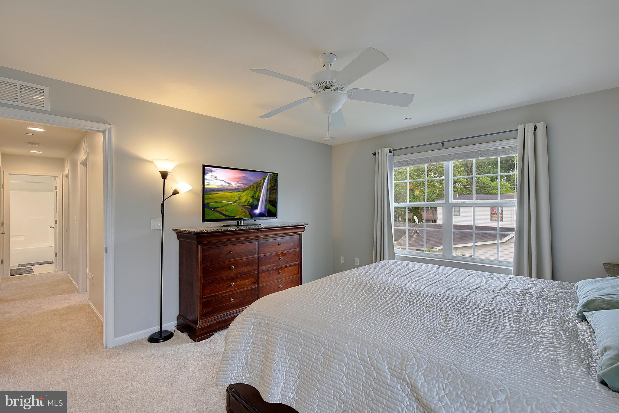 403 Venton Road Edgewater, MD 21037 - Photo 29 of 62 a bedroom with a bed and a flat screen tv