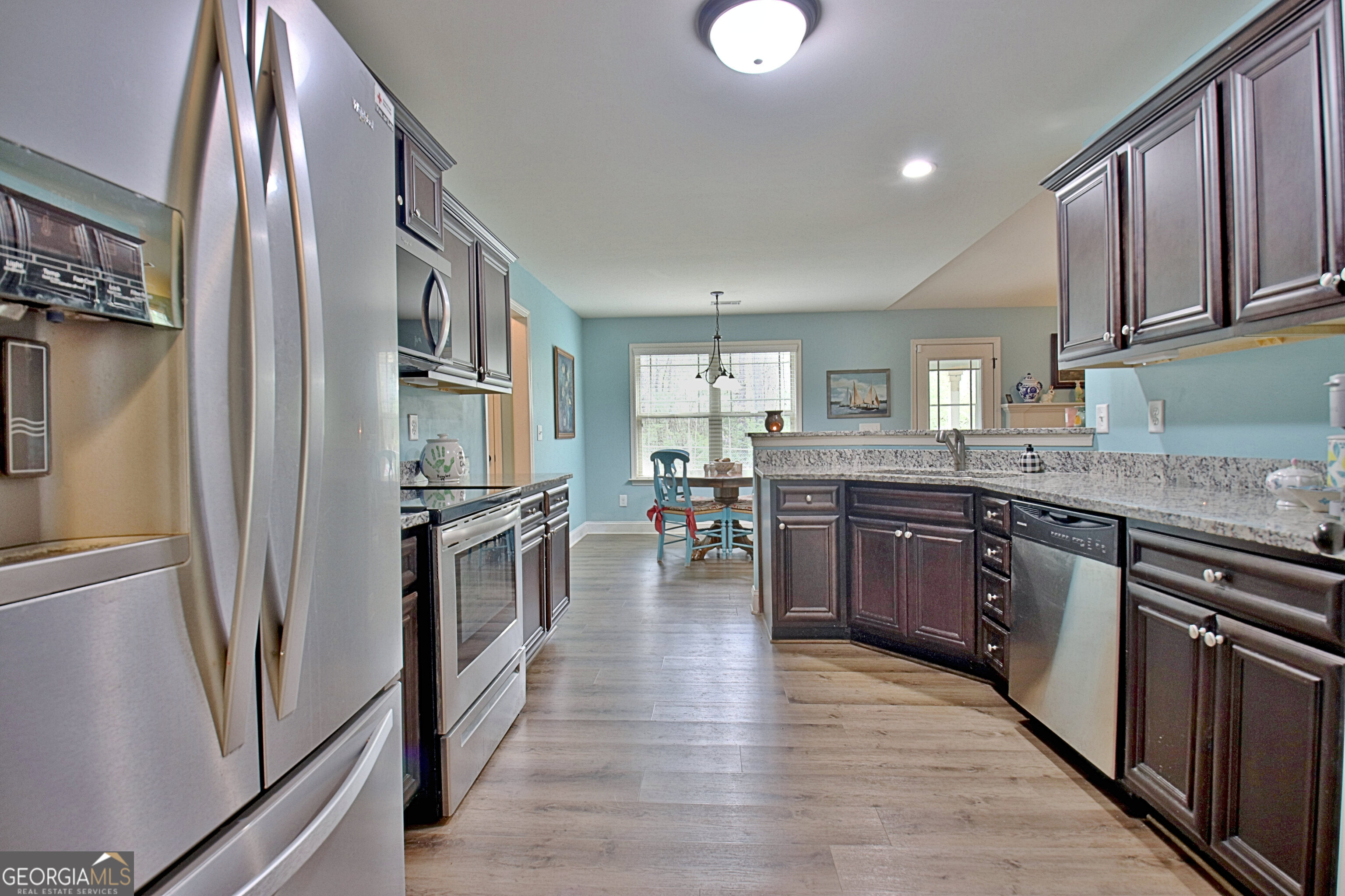 96 East Gordon Road Newnan, GA 30263 - Photo 14 of 34 a kitchen with stainless steel appliances granite countertop a refrigerator a stove top oven a sink and dishwasher
