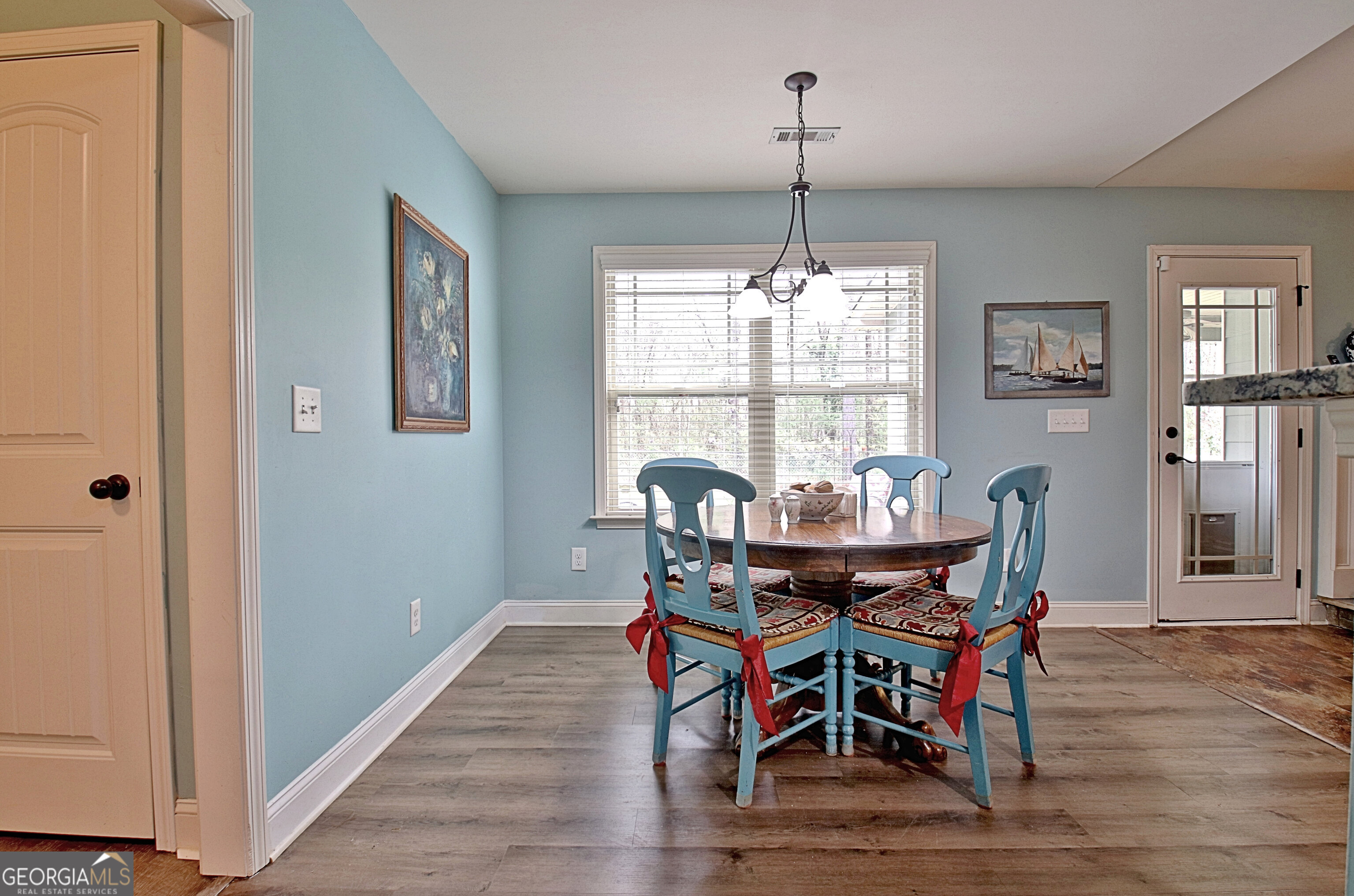 96 East Gordon Road Newnan, GA 30263 - Photo 15 of 34 a view of a dining room with furniture window and wooden floor