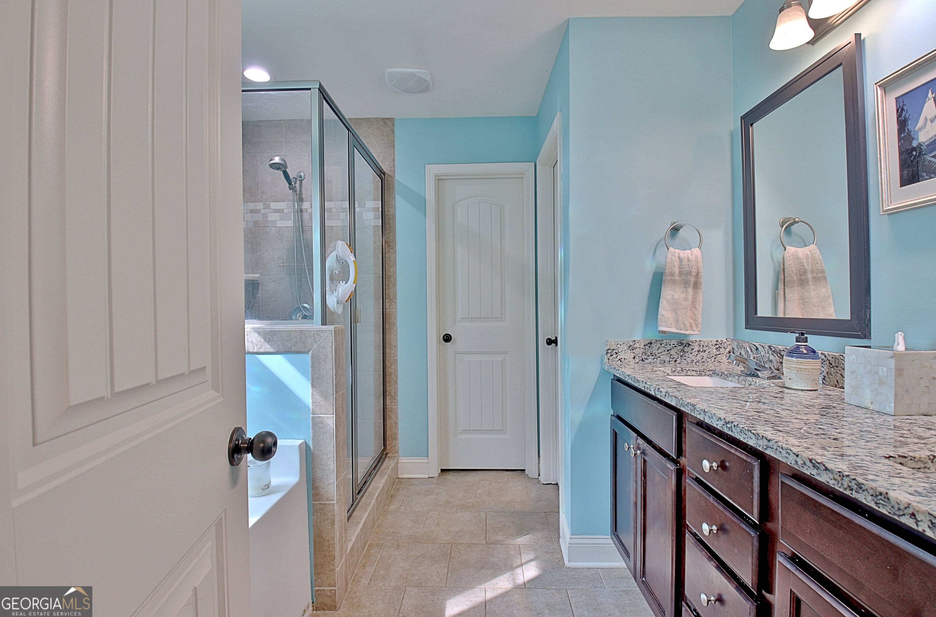 96 East Gordon Road Newnan, GA 30263 - Photo 18 of 34 a bathroom with a granite countertop sink and a mirror