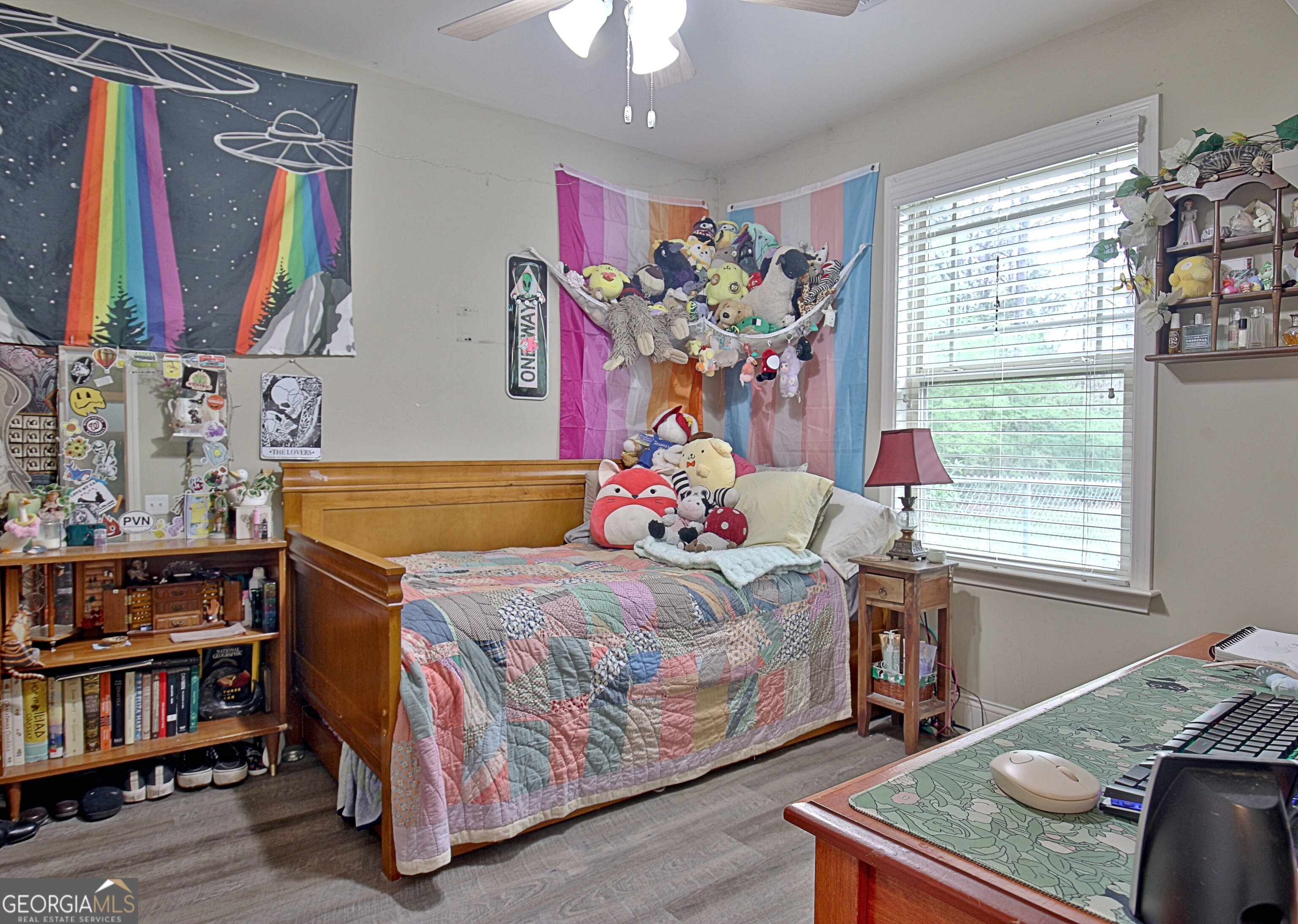96 East Gordon Road Newnan, GA 30263 - Photo 22 of 34 a bedroom with a bed and a bookshelf