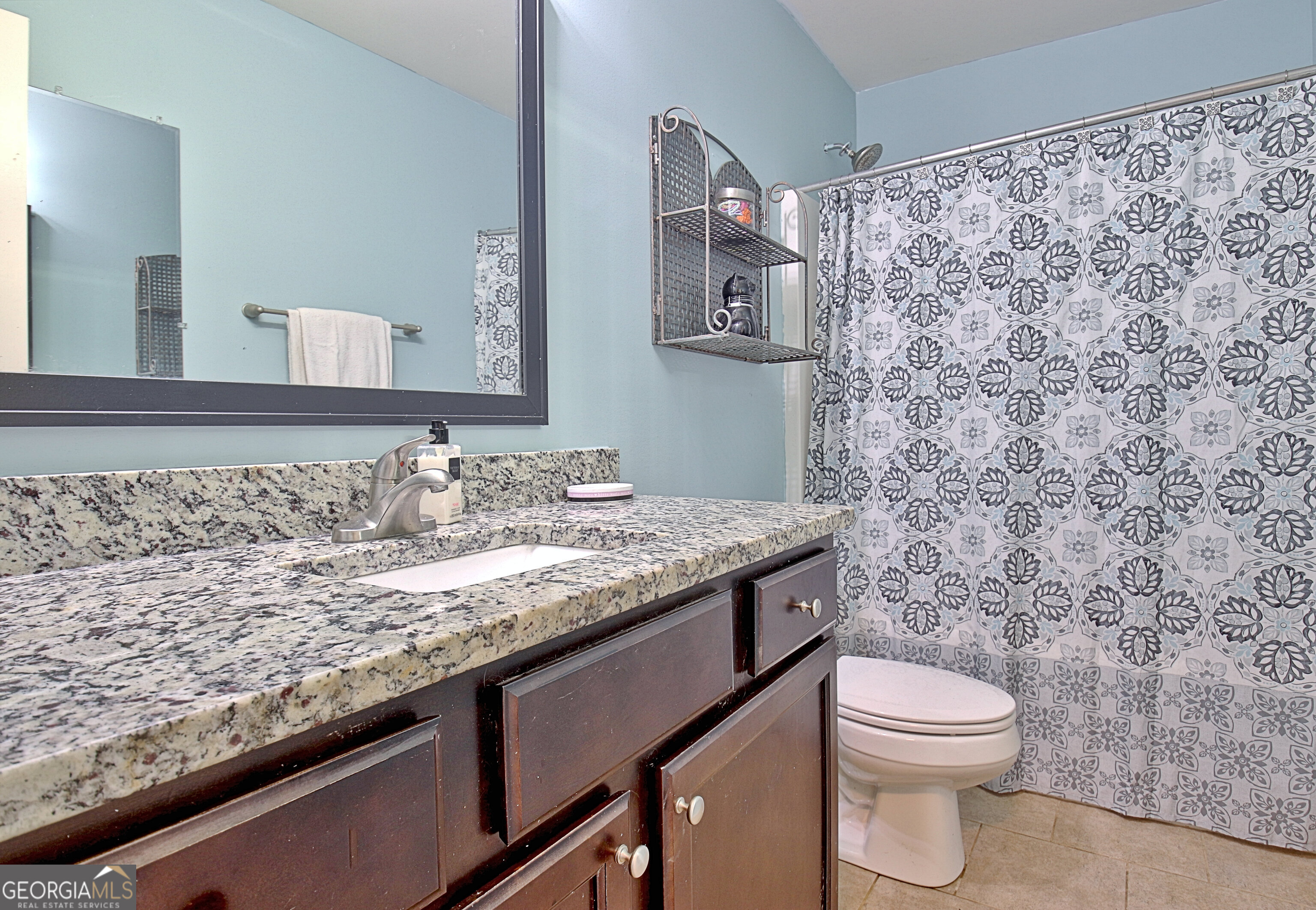 96 East Gordon Road Newnan, GA 30263 - Photo 24 of 34 a bathroom with a granite countertop sink and a toilet