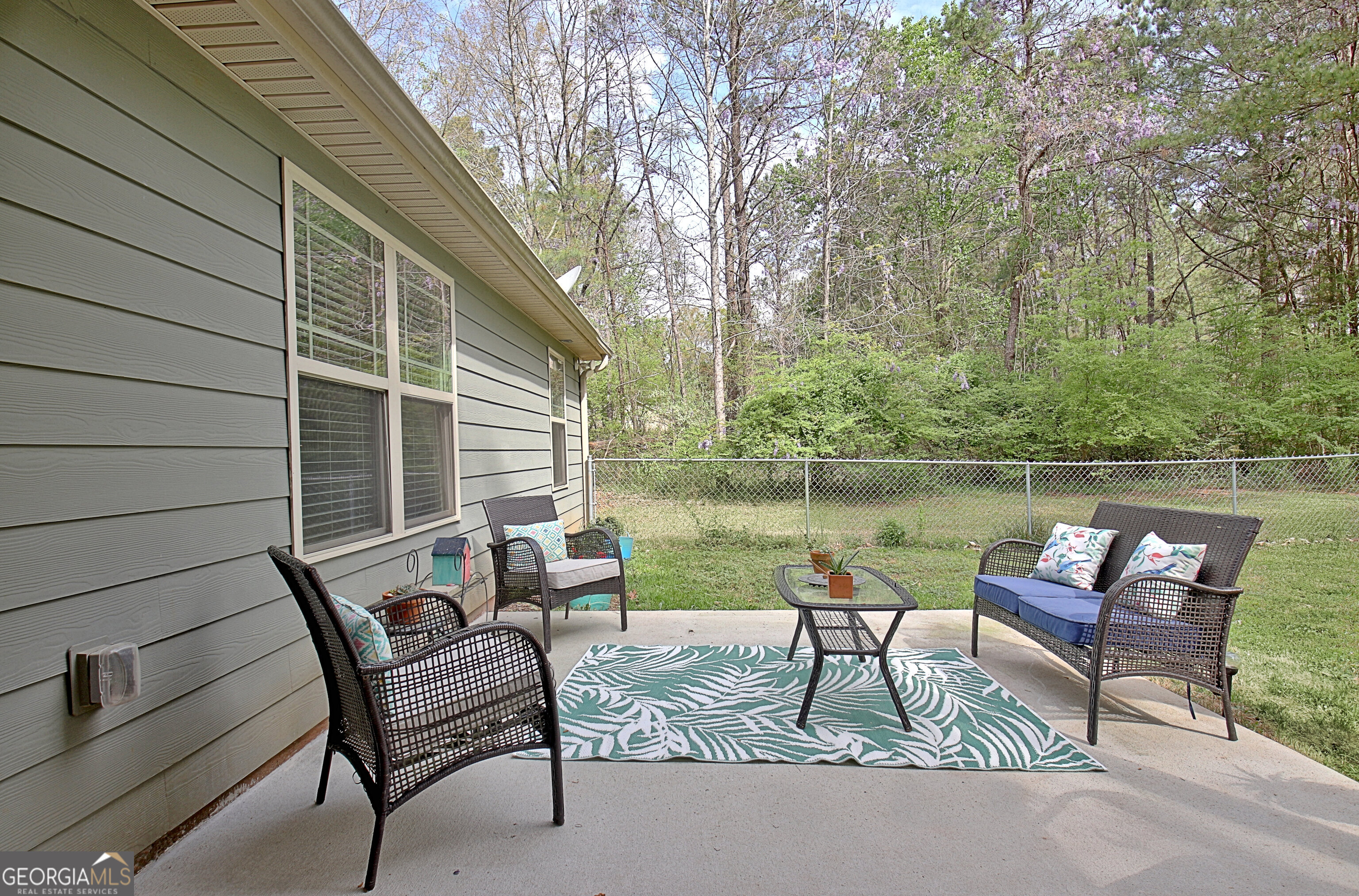 96 East Gordon Road Newnan, GA 30263 - Photo 30 of 34 a house view with a outdoor seating