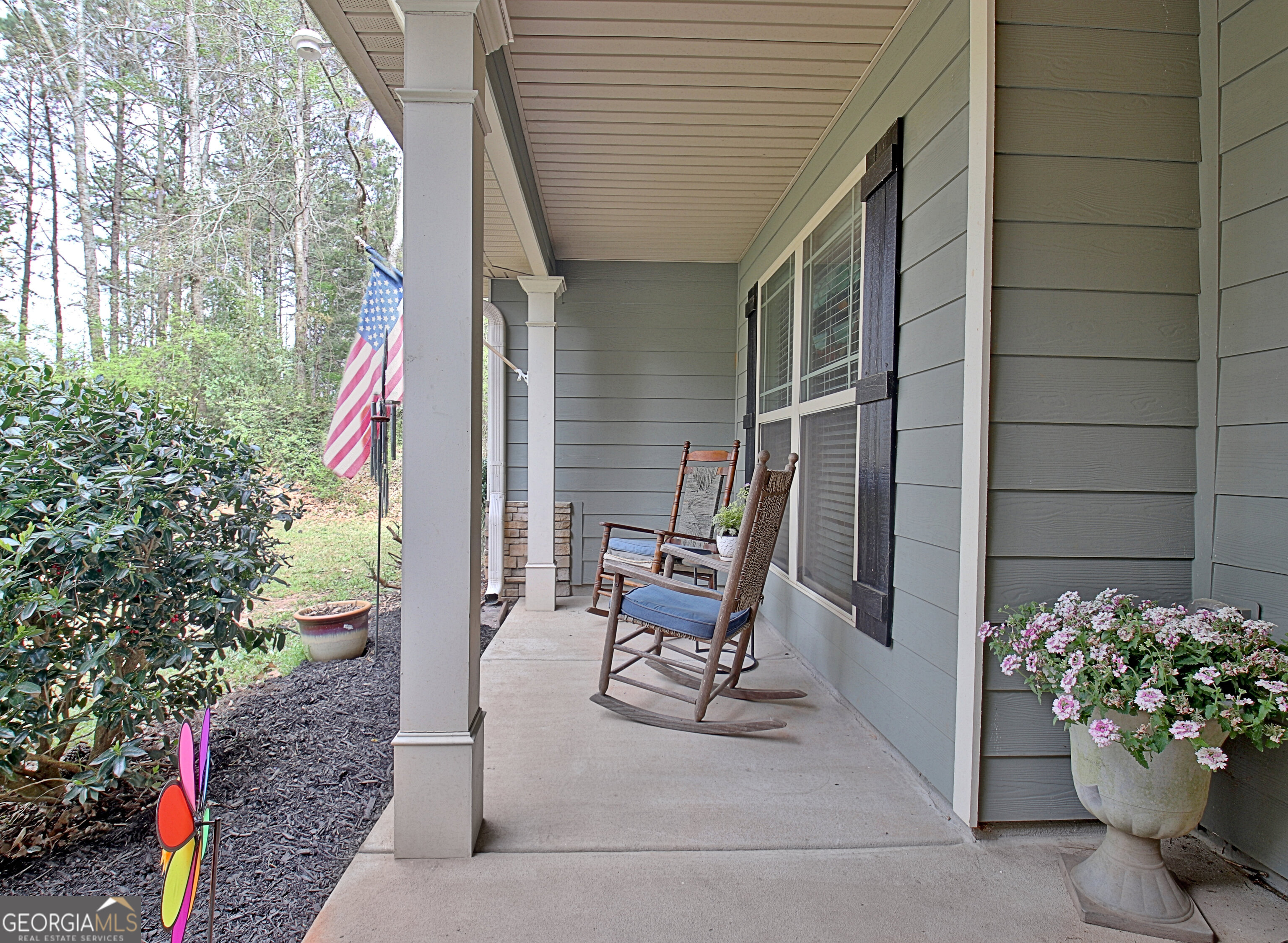 96 East Gordon Road Newnan, GA 30263 - Photo 5 of 34 a view of backyard with a chair and potted plants