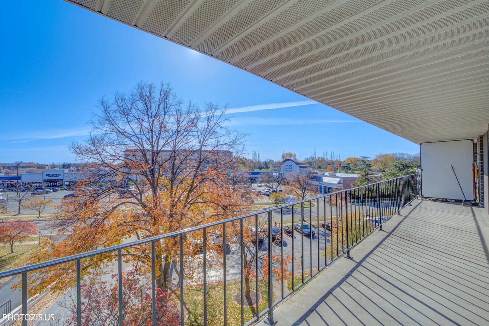 4900 Foster Street, Unit 412 Skokie, IL 60077 - Photo 19 of 32 a view of a balcony with wooden stairs