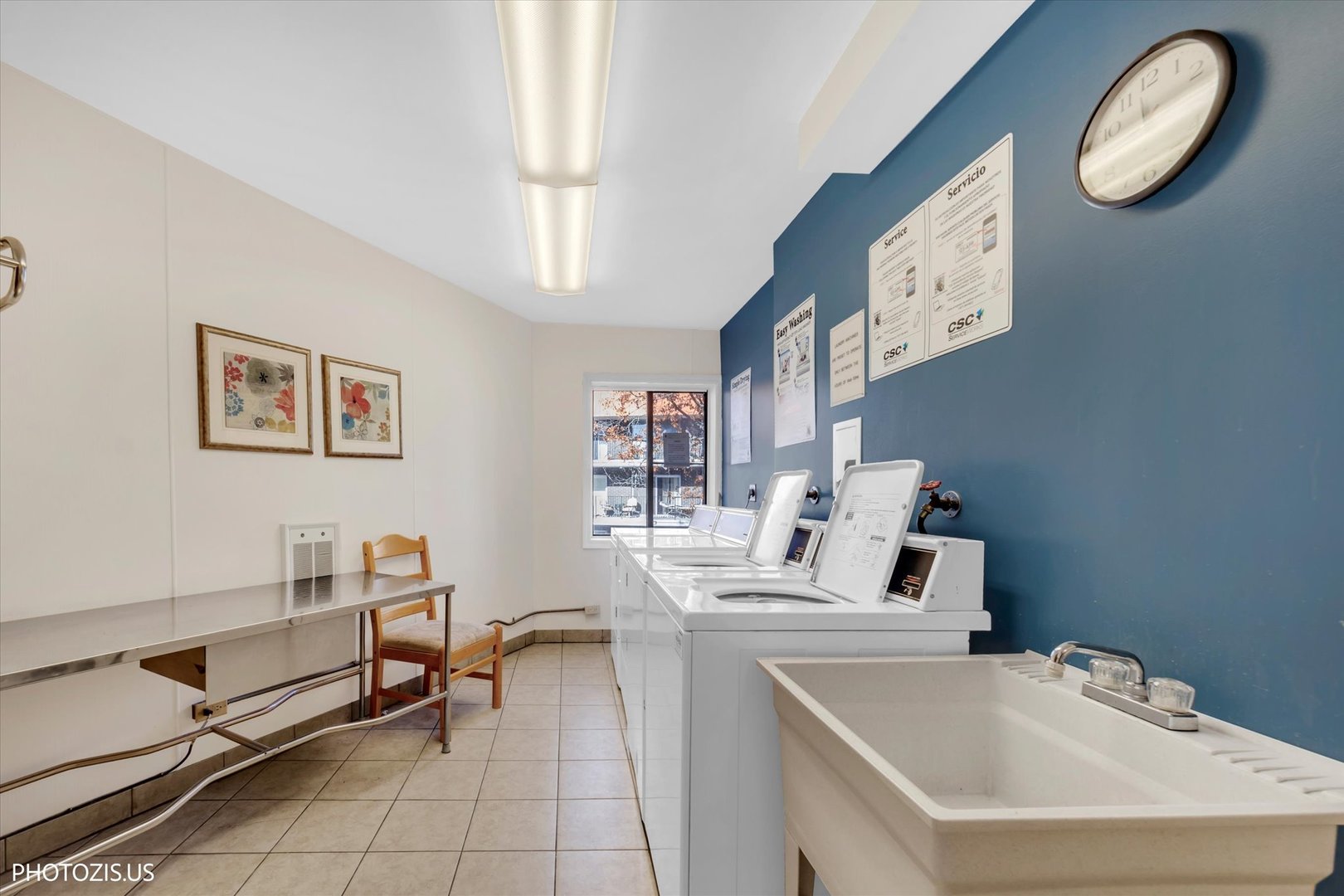 4900 Foster Street, Unit 412 Skokie, IL 60077 - Photo 25 of 32 a room with table chairs and white walls