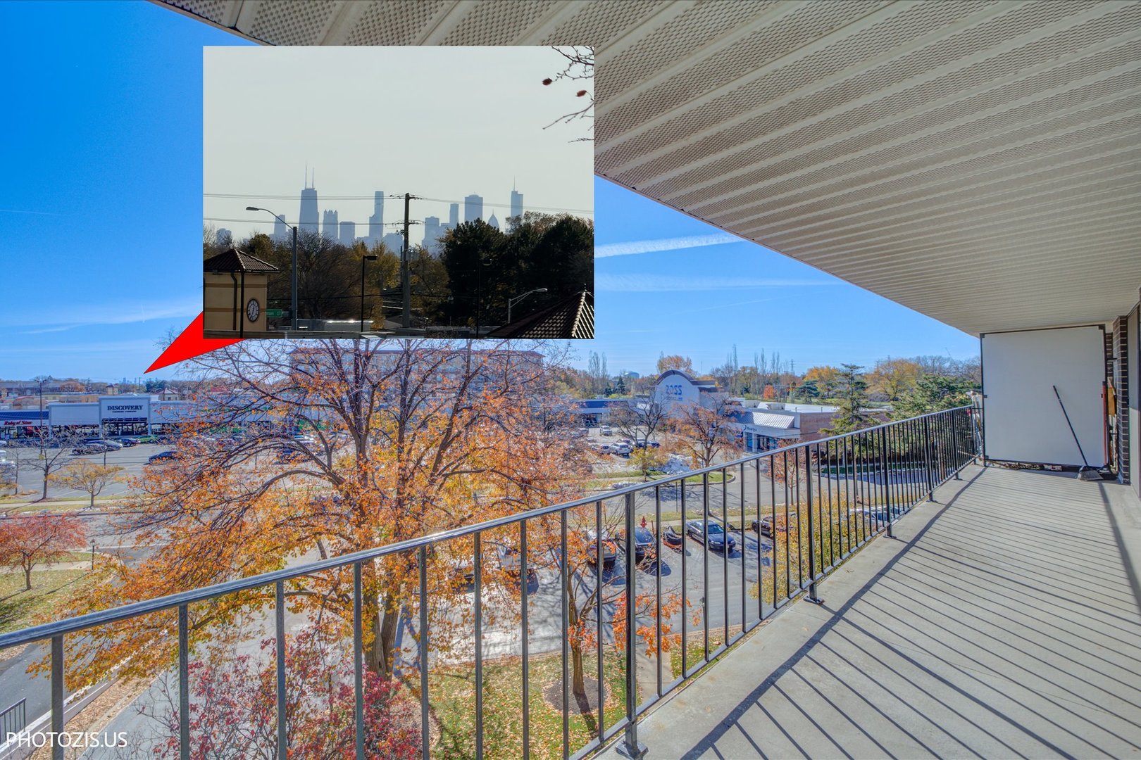 4900 Foster Street, Unit 412 Skokie, IL 60077 - Photo 31 of 32 a view of a balcony with wooden floor and city view