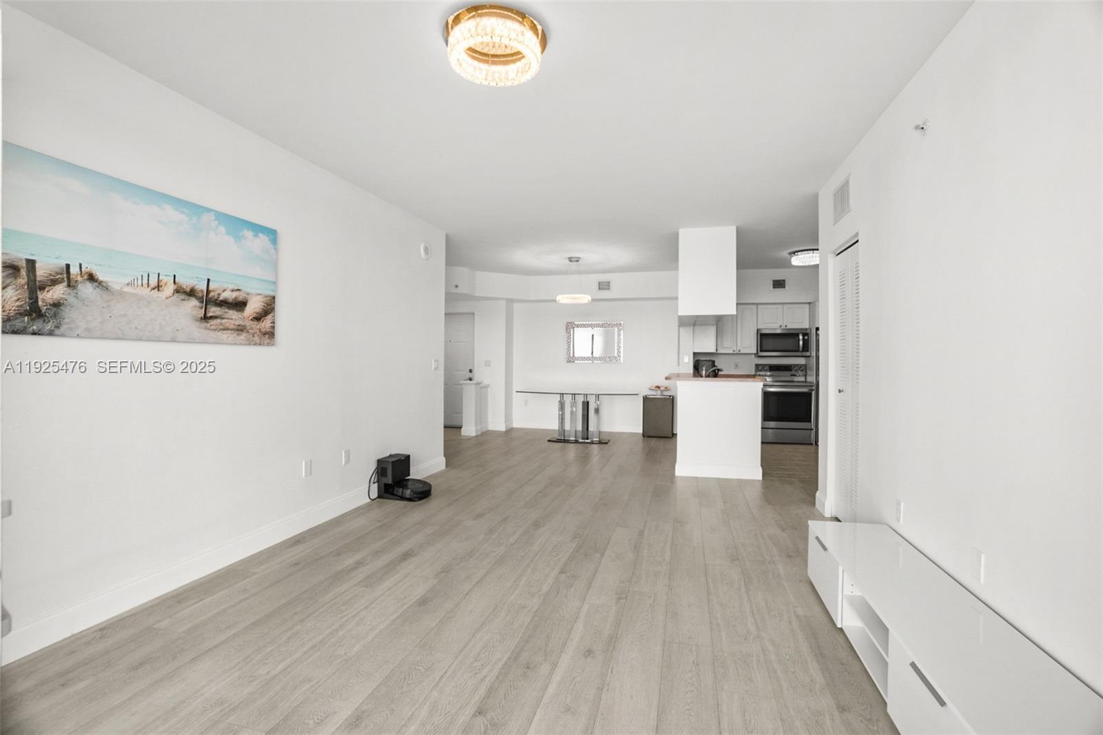 17150 North Bay Road, Unit 2706 Sunny Isles Beach, FL 33160 - Photo 15 of 47 a view of a kitchen with wooden floor