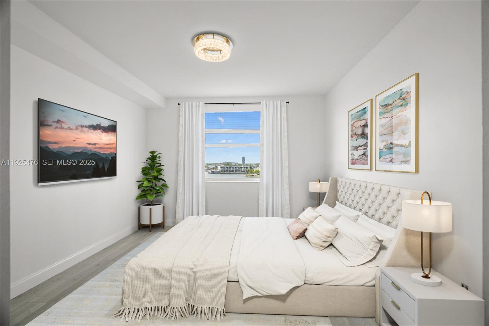 17150 North Bay Road, Unit 2706 Sunny Isles Beach, FL 33160 - Photo 18 of 47 a bedroom with a bed and a potted plant