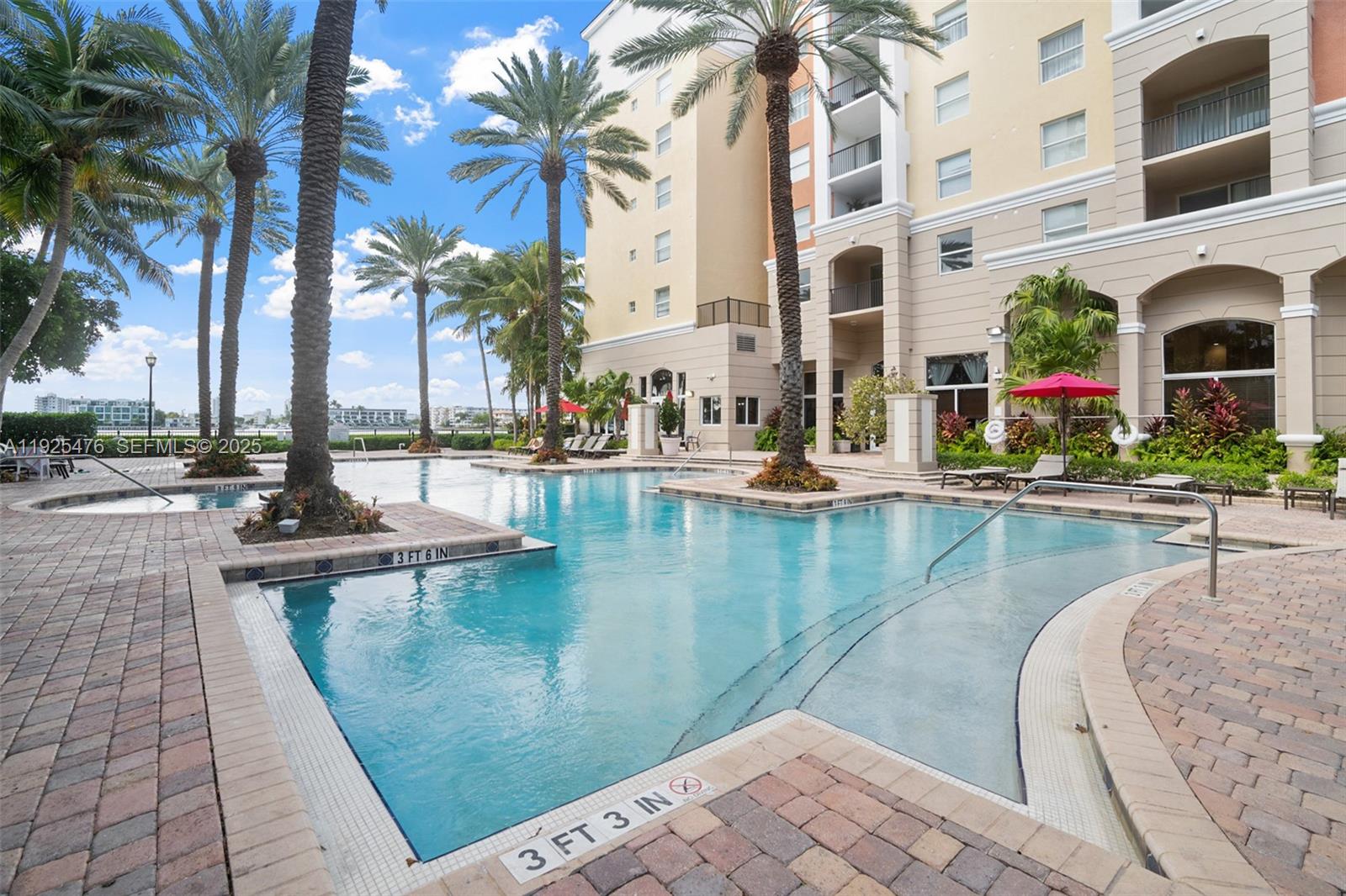17150 North Bay Road, Unit 2706 Sunny Isles Beach, FL 33160 - Photo 30 of 47 a view of a swimming pool with a patio