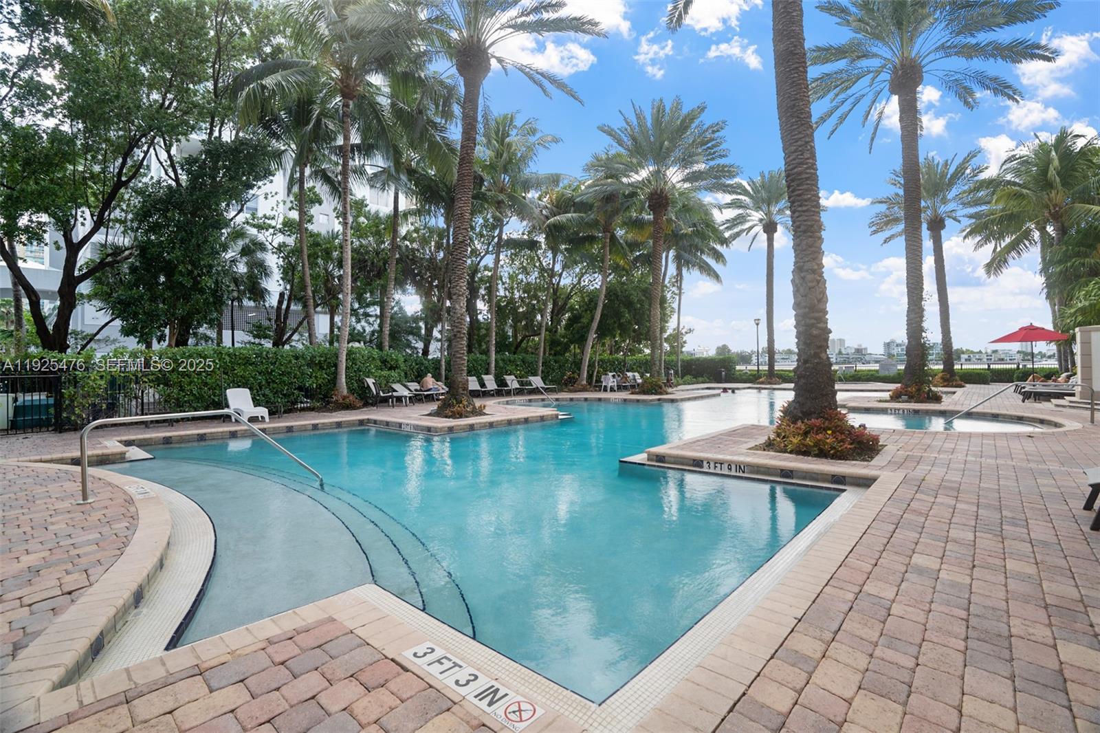 17150 North Bay Road, Unit 2706 Sunny Isles Beach, FL 33160 - Photo 32 of 47 a view of swimming pool with chairs