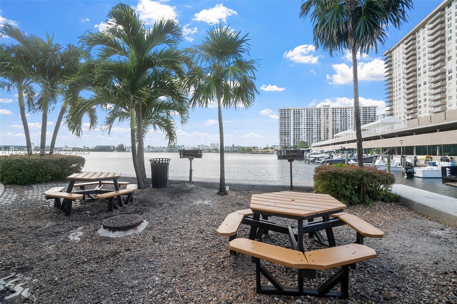 17150 North Bay Road, Unit 2706 Sunny Isles Beach, FL 33160 - Photo 36 of 47 a view of a backyard with a sitting area and furniture