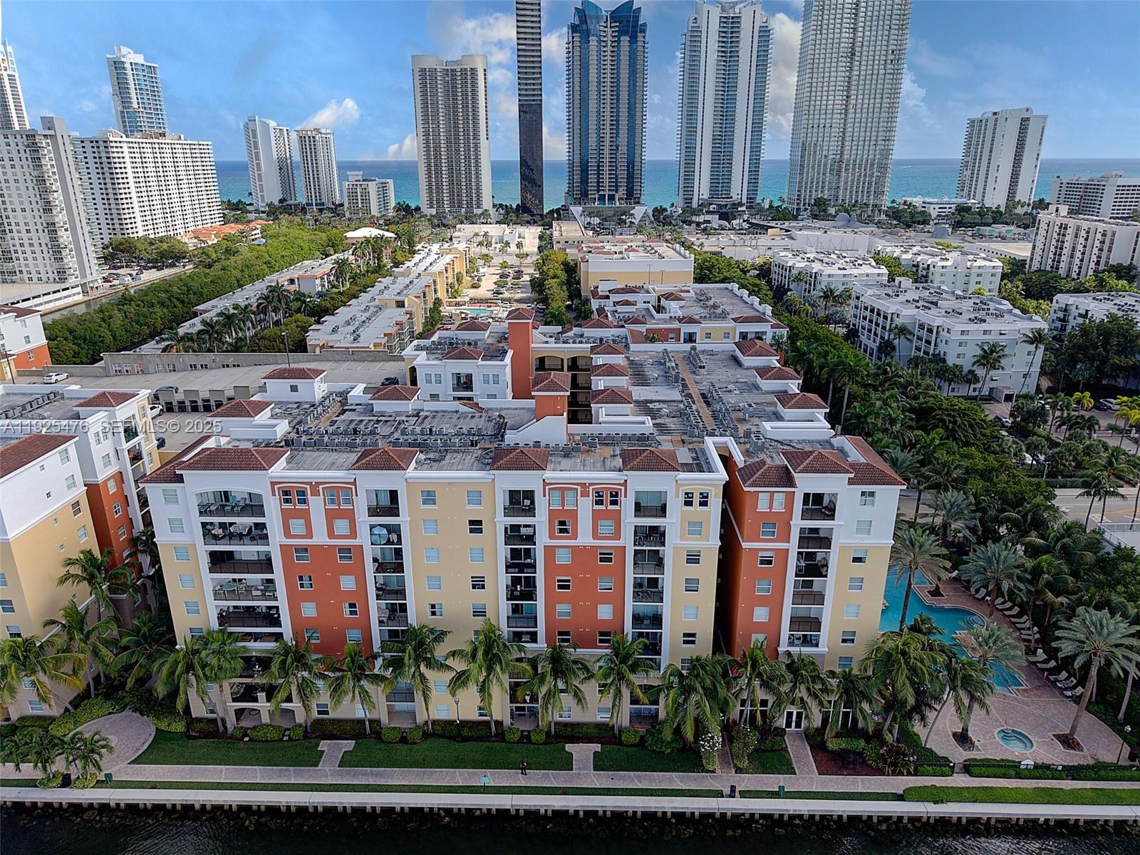 17150 North Bay Road, Unit 2706 Sunny Isles Beach, FL 33160 - Photo 45 of 47 a large building with a clock on the side of it