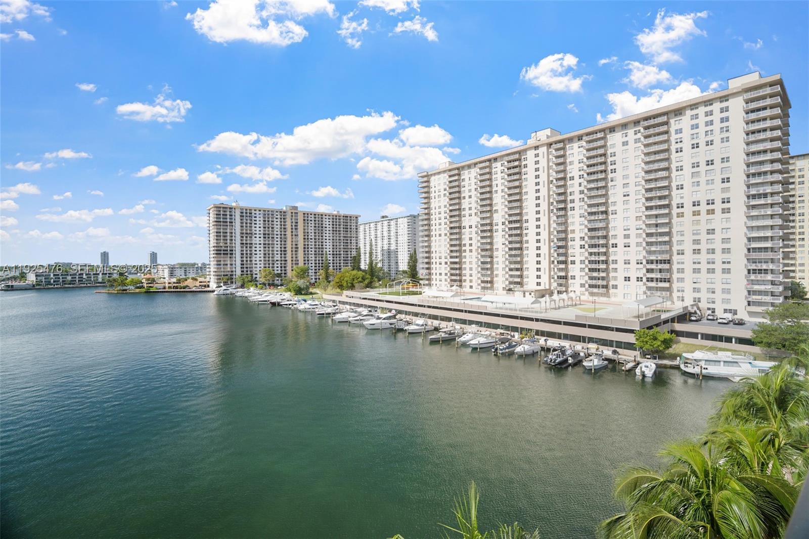 17150 North Bay Road, Unit 2706 Sunny Isles Beach, FL 33160 - Photo 6 of 47 a view of building with lake view and boat