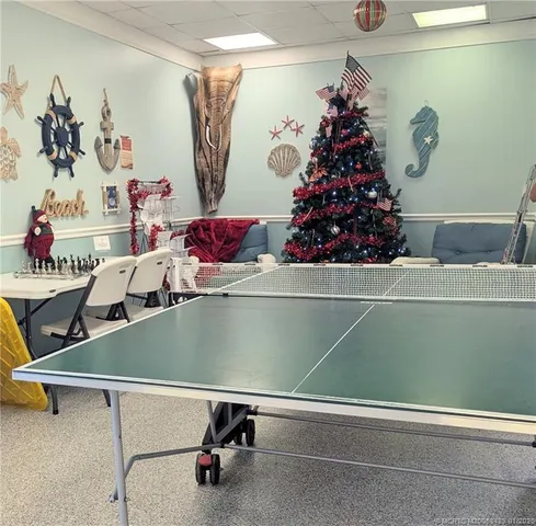 a swimming pool with outdoor seating