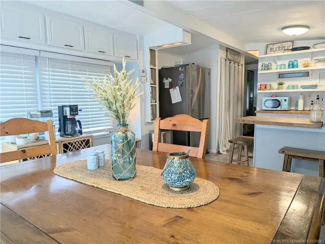 a kitchen with a table and chairs in it