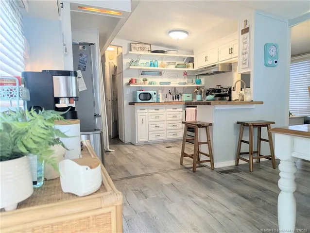 a kitchen with appliances and cabinets