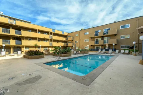 a view of swimming pool with outdoor seating