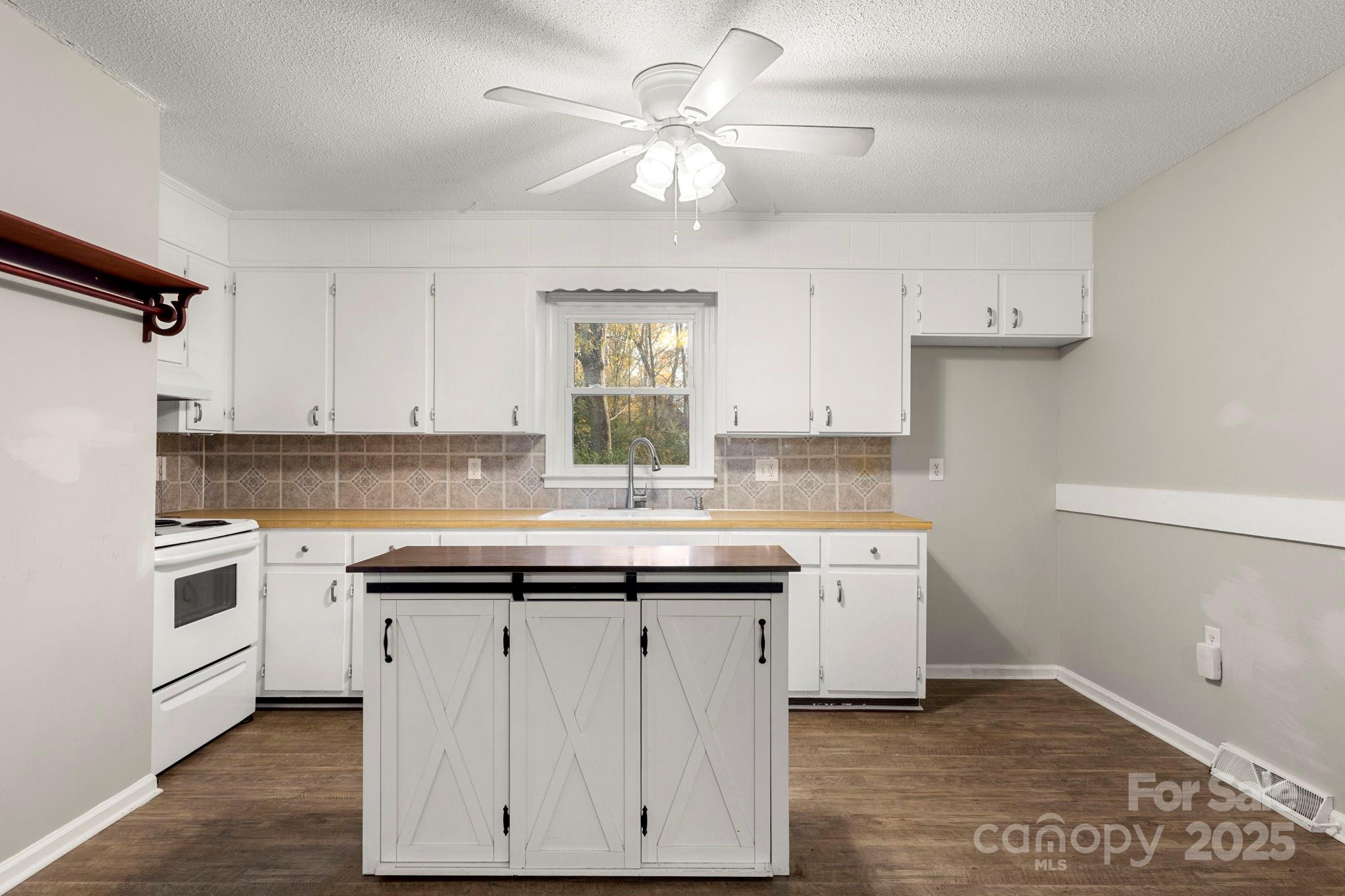 604 Cold Stream Circle Chester, SC 29706 - Photo 3 of 26 a kitchen with a sink dishwasher a stove and a refrigerator