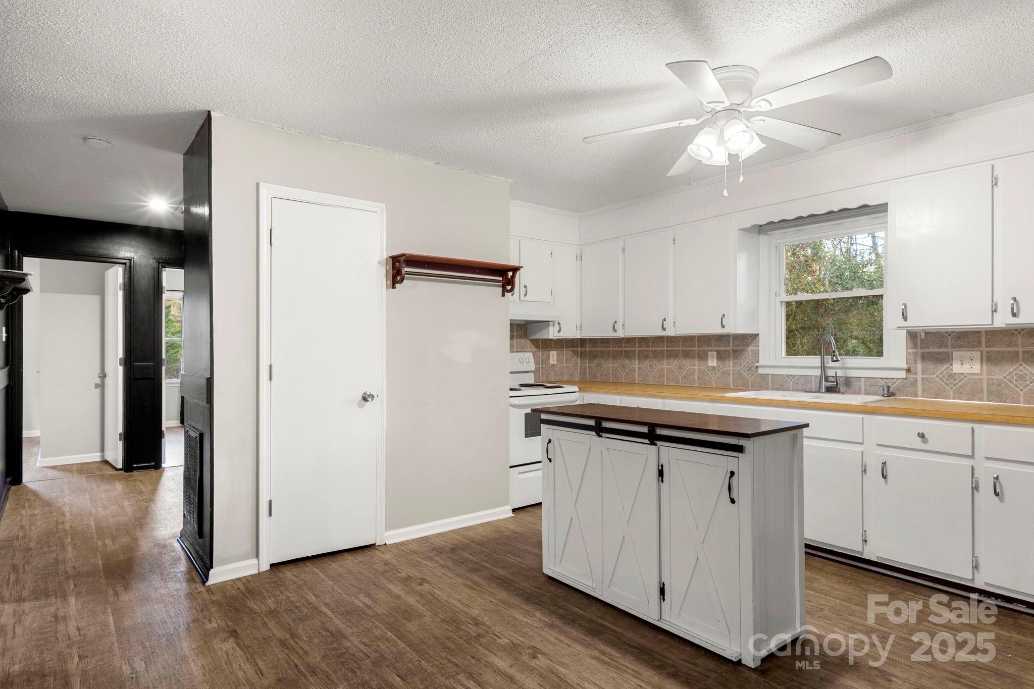 604 Cold Stream Circle Chester, SC 29706 - Photo 4 of 26 a kitchen with a sink a refrigerator and cabinets