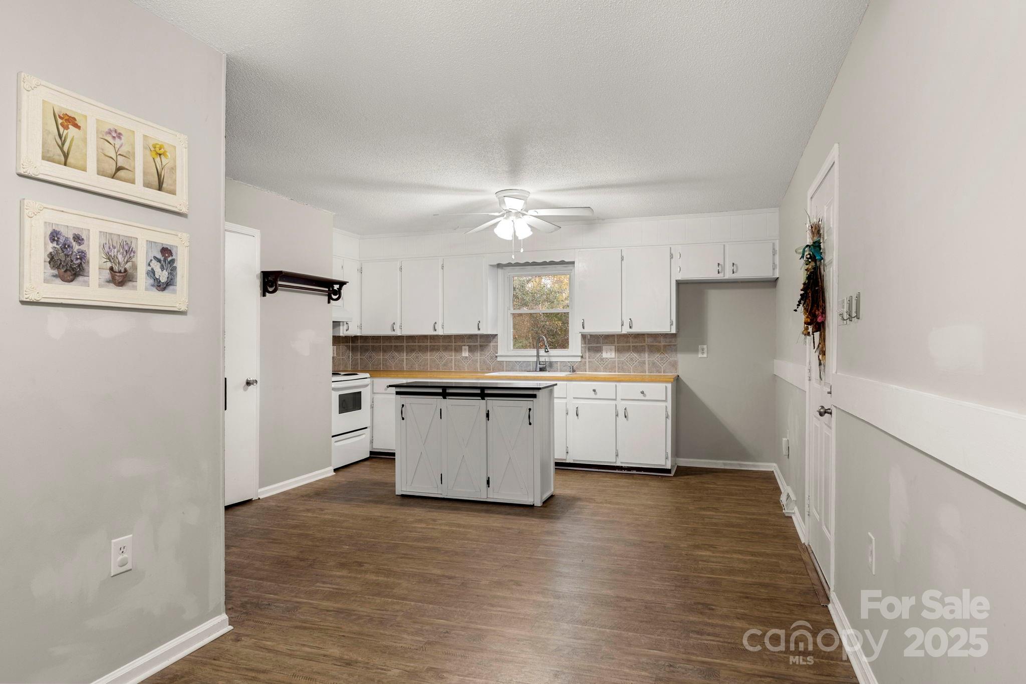 604 Cold Stream Circle Chester, SC 29706 - Photo 5 of 26 a kitchen with a refrigerator a sink and dishwasher with wooden floor