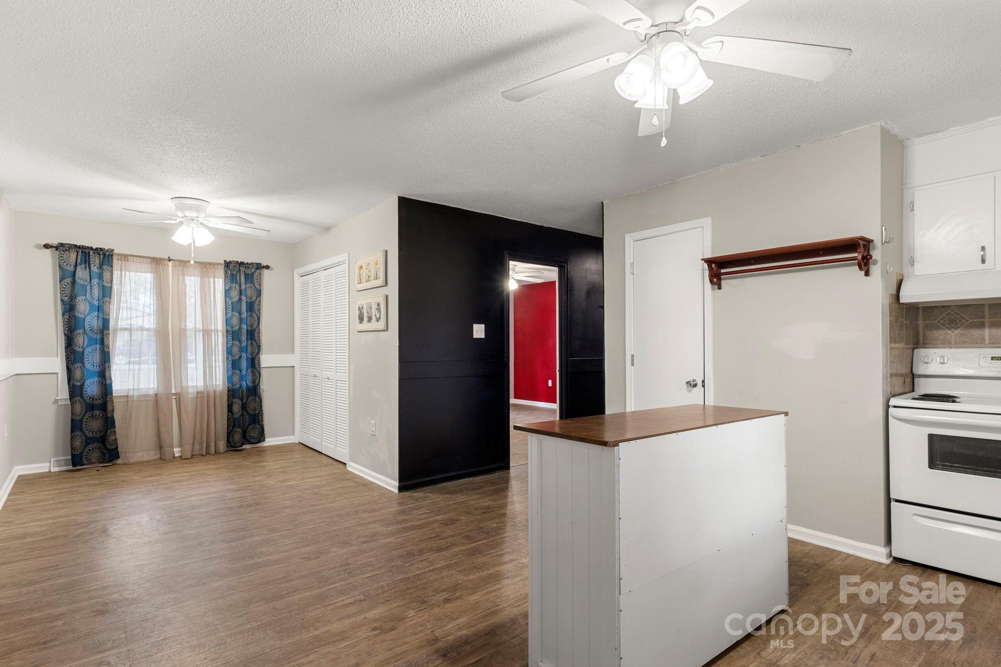 604 Cold Stream Circle Chester, SC 29706 - Photo 6 of 26 a view of a kitchen with an empty room and wooden floor