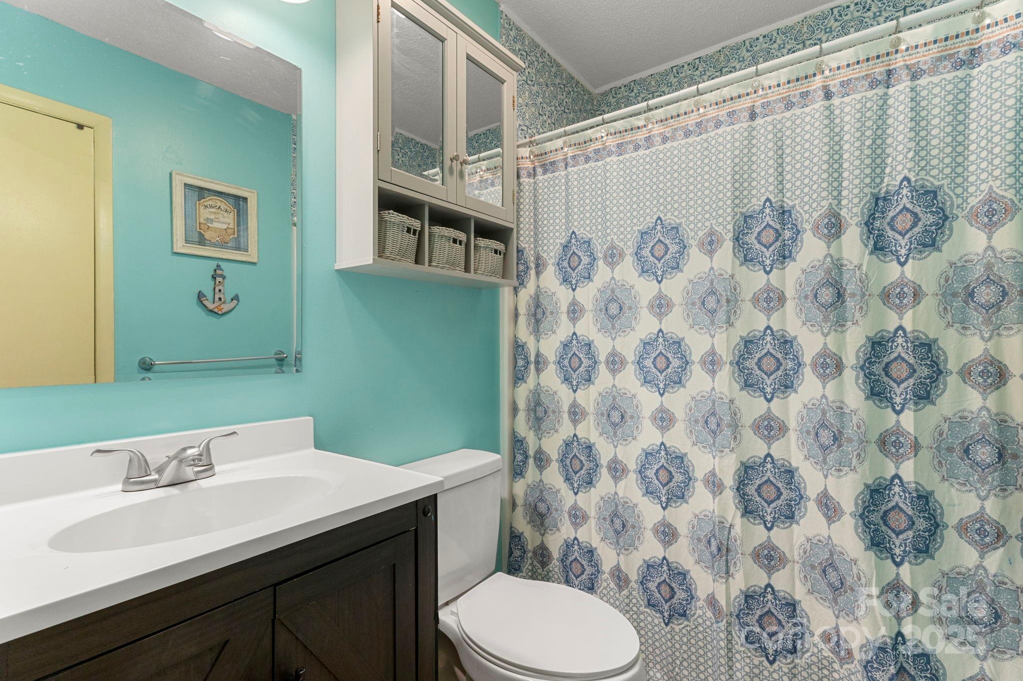 604 Cold Stream Circle Chester, SC 29706 - Photo 10 of 26 a bathroom with a sink and a mirror