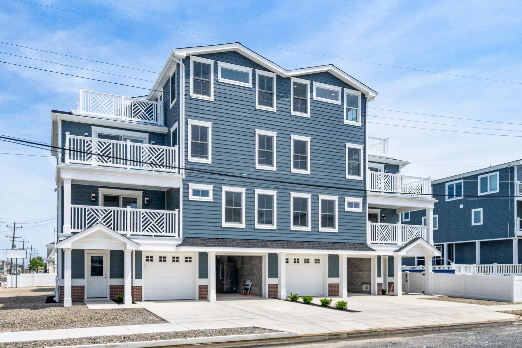 a front view of a building with a yard