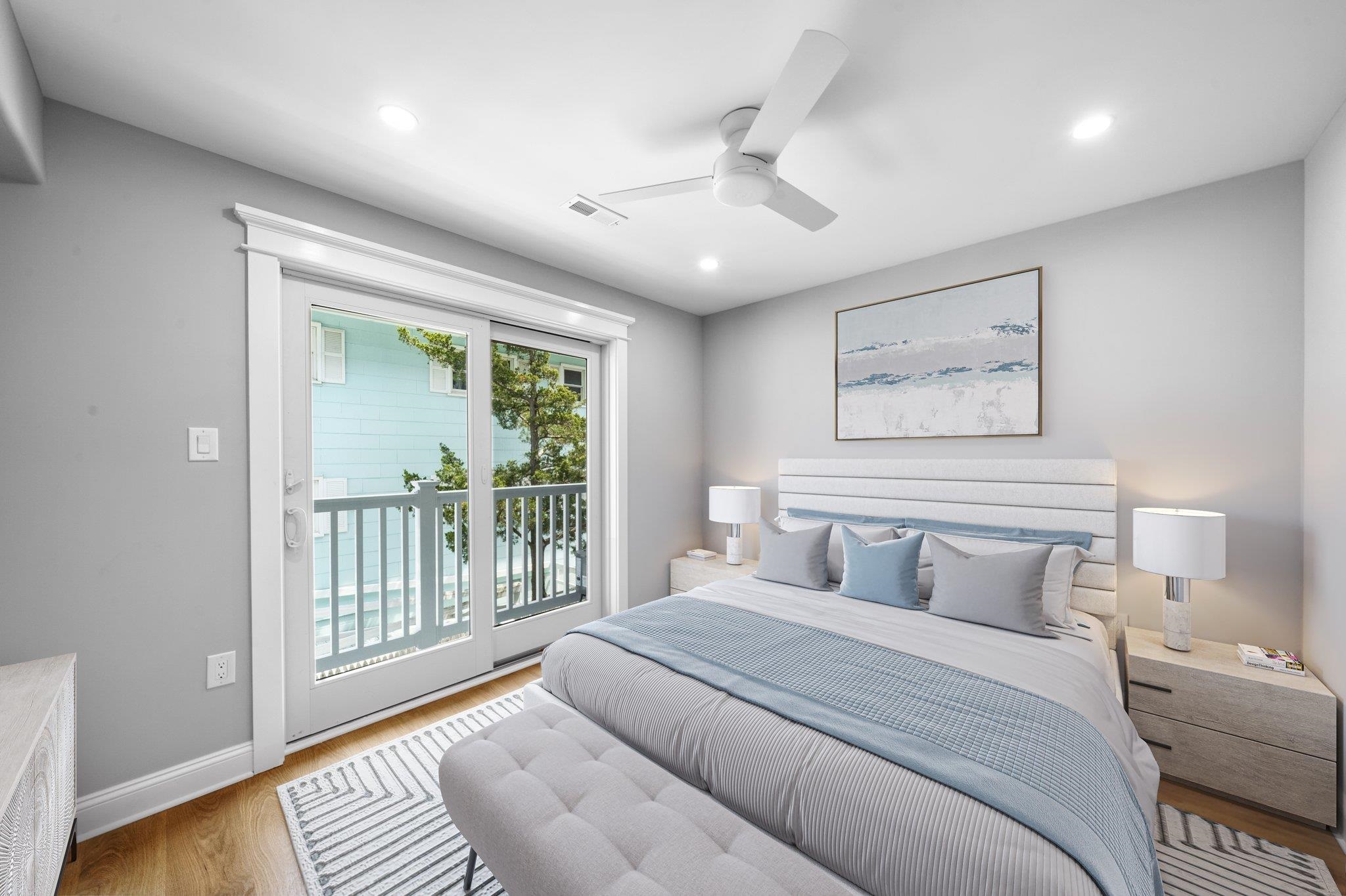 297 24th, Unit 297 Avalon, NJ 08202 - Photo 11 of 49 a bedroom with a large bed and a window