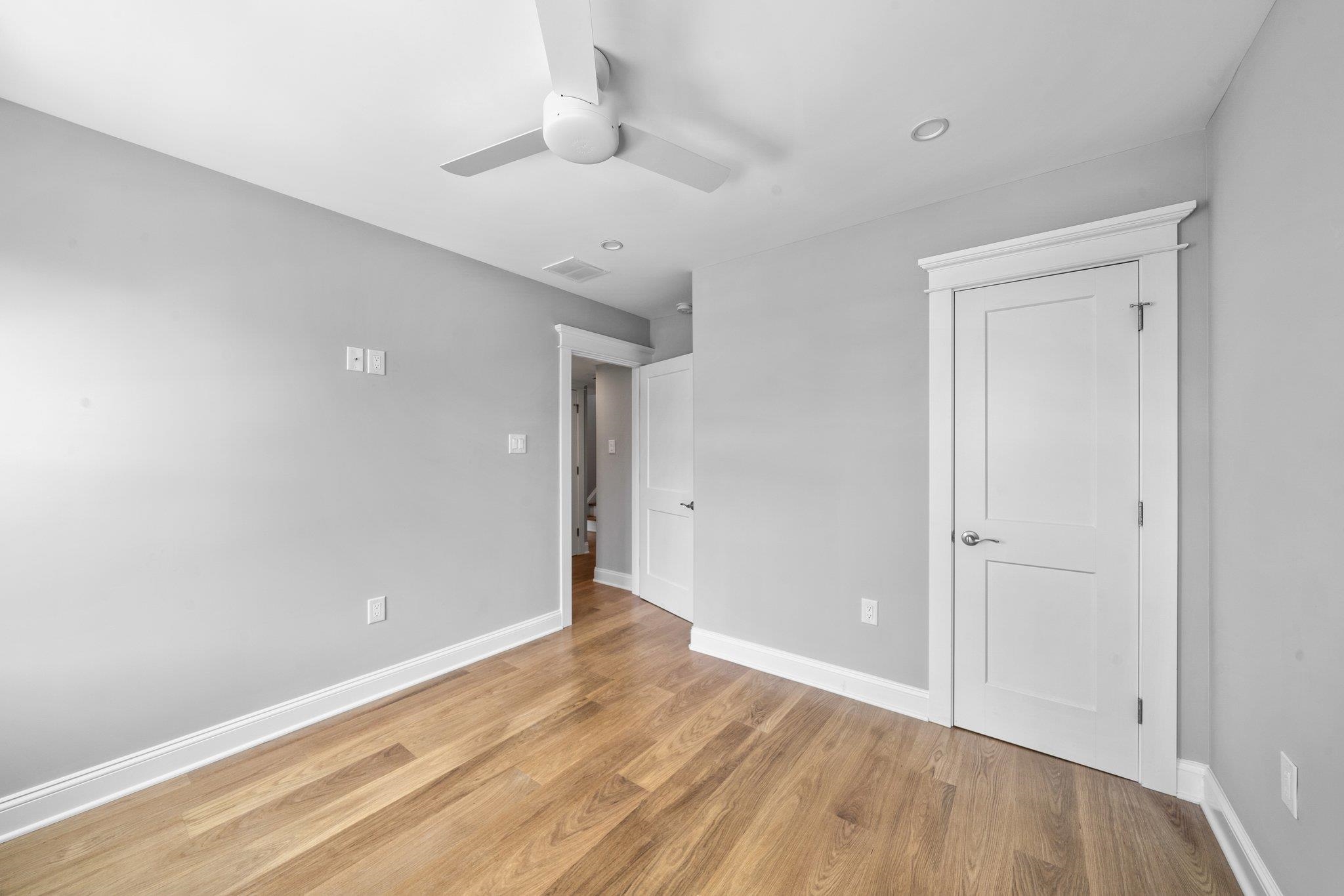 297 24th, Unit 297 Avalon, NJ 08202 - Photo 15 of 49 a view of an empty room with wooden floor