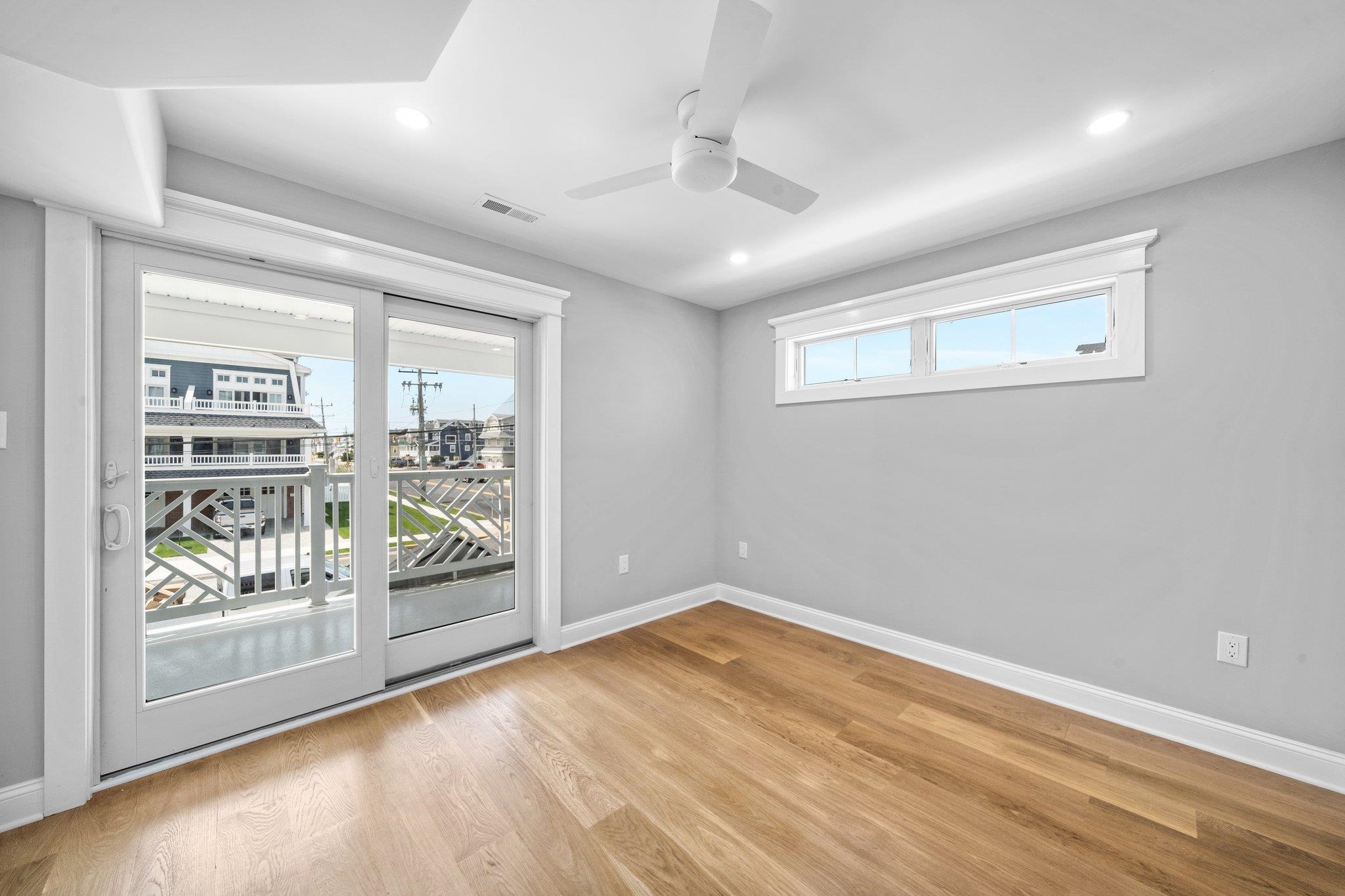 297 24th, Unit 297 Avalon, NJ 08202 - Photo 21 of 49 an empty room with windows