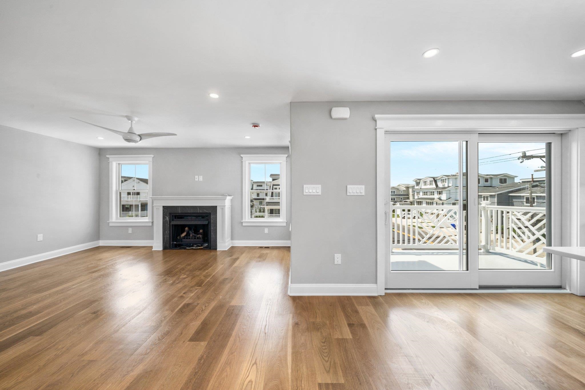 297 24th, Unit 297 Avalon, NJ 08202 - Photo 27 of 49 a view of empty room with wooden floor and fireplace
