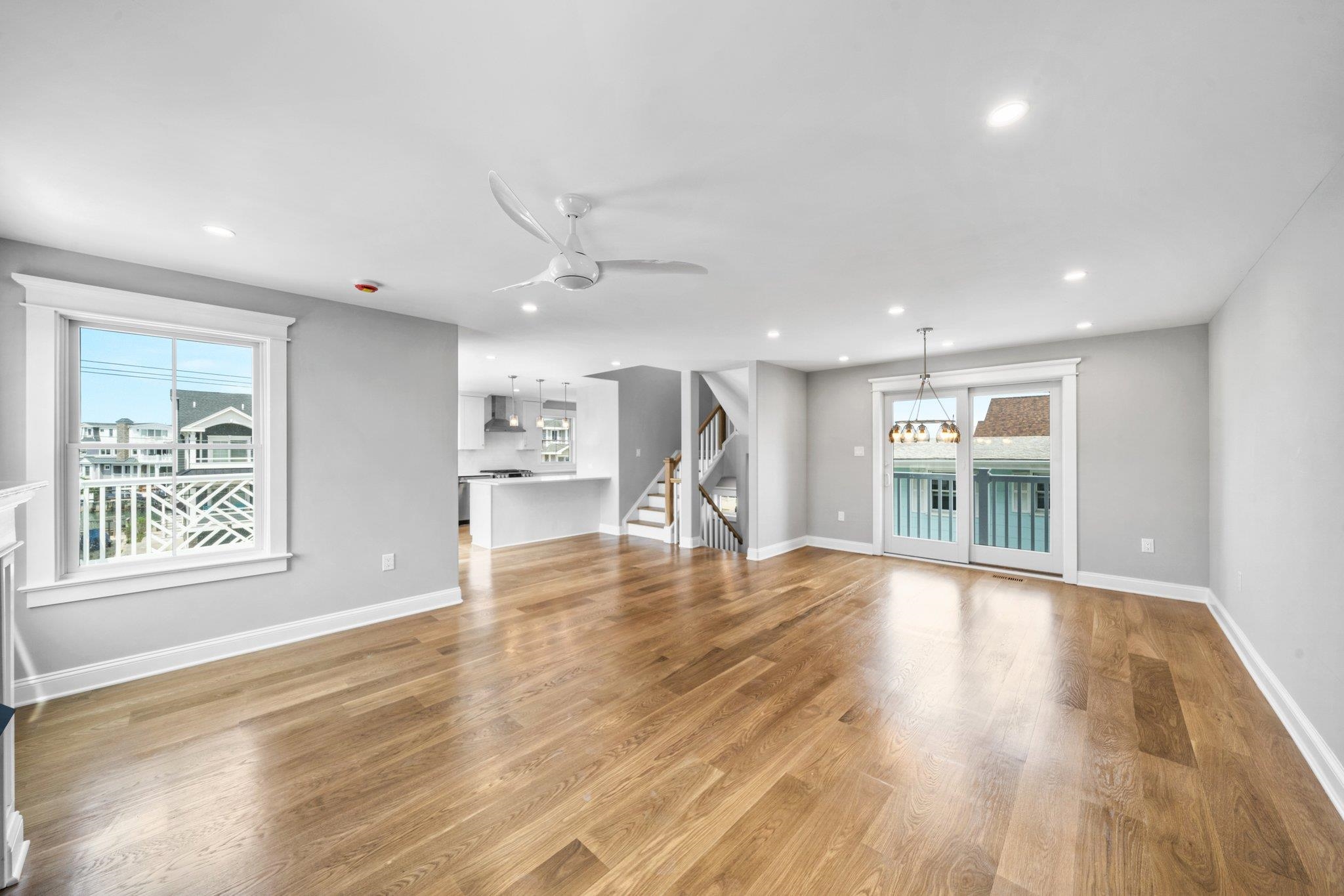 297 24th, Unit 297 Avalon, NJ 08202 - Photo 28 of 49 a view of an empty room with wooden floor and a window