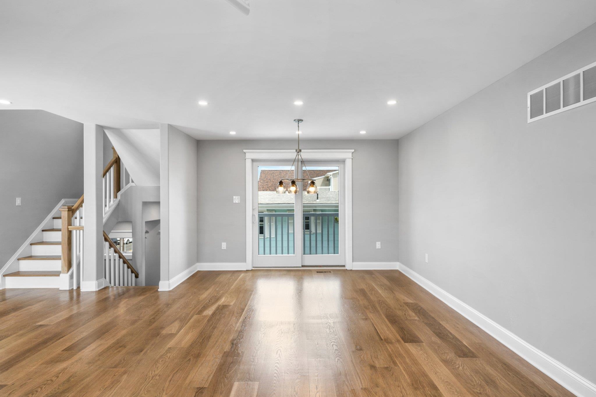 297 24th, Unit 297 Avalon, NJ 08202 - Photo 29 of 49 wooden floor in an empty room with a window
