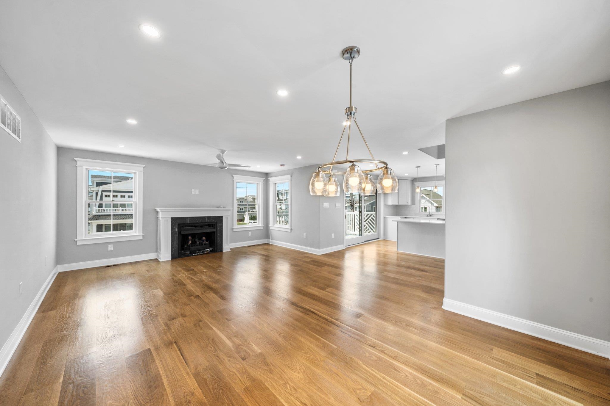 297 24th, Unit 297 Avalon, NJ 08202 - Photo 30 of 49 a view of empty room with wooden floor and fireplace