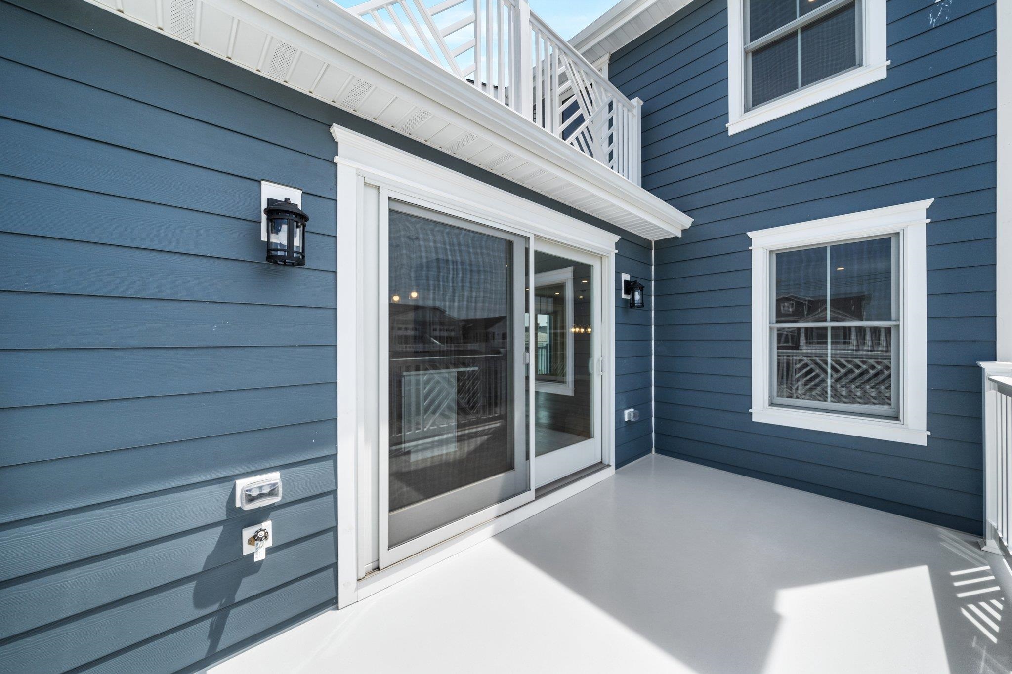297 24th, Unit 297 Avalon, NJ 08202 - Photo 39 of 49 a view of a brick house with a large window