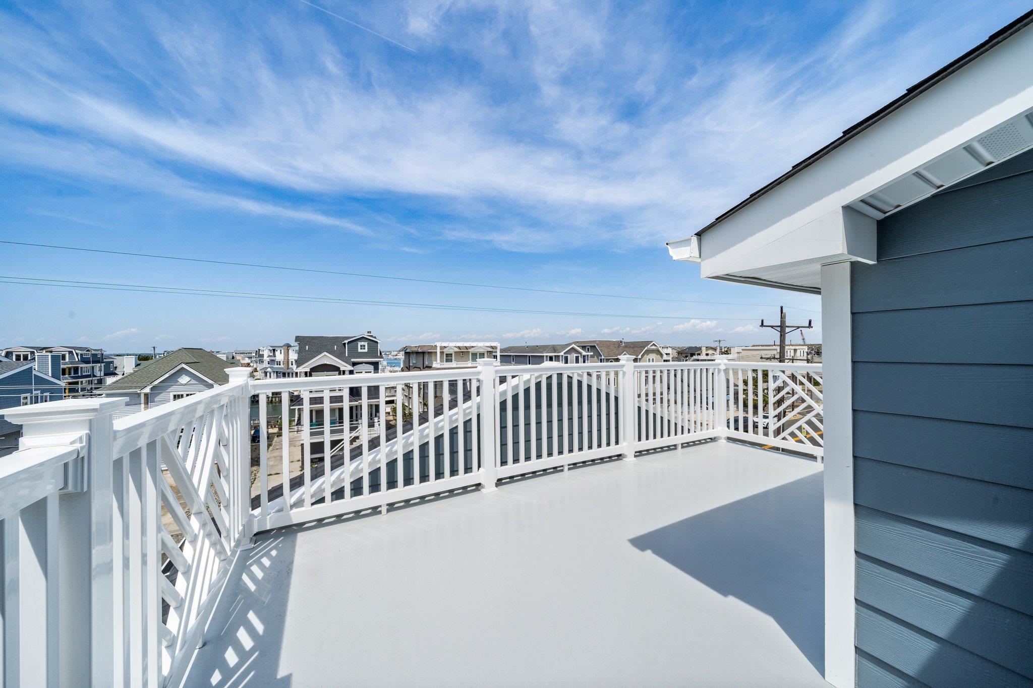 297 24th, Unit 297 Avalon, NJ 08202 - Photo 42 of 49 a view of a balcony with an outdoor space