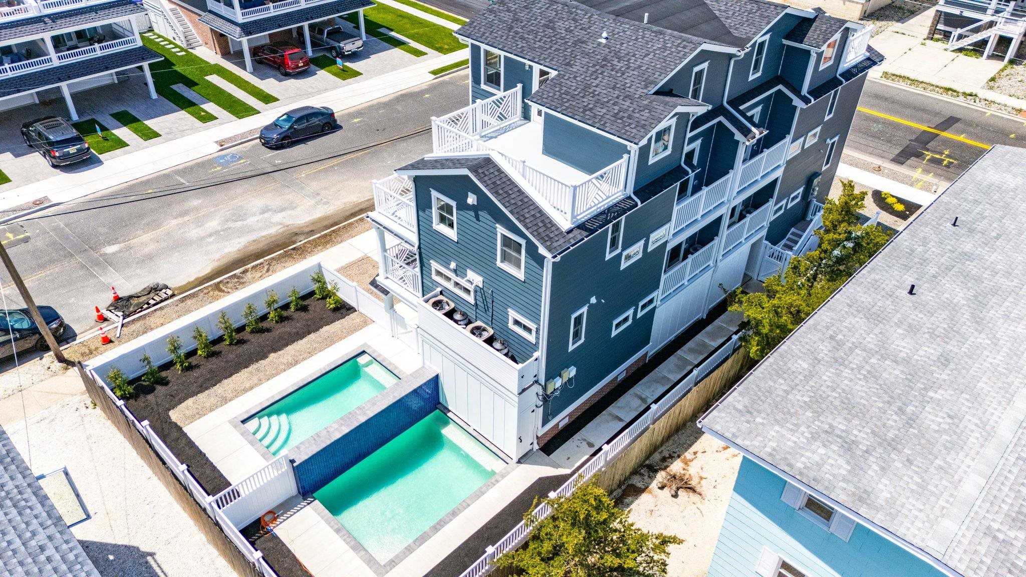 297 24th, Unit 297 Avalon, NJ 08202 - Photo 48 of 49 aerial view of a house with a yard
