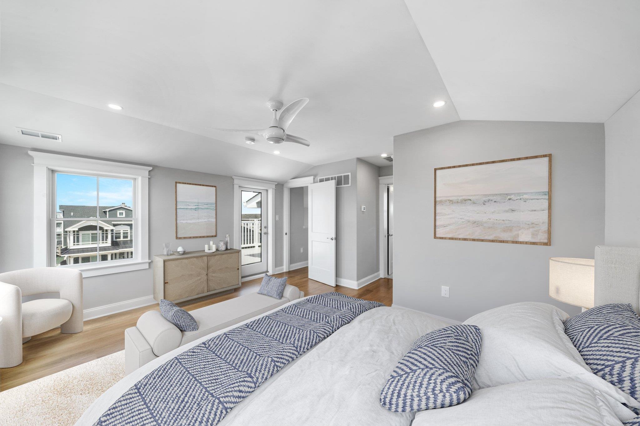 297 24th, Unit 297 Avalon, NJ 08202 - Photo 6 of 49 a bedroom with a large bed couch and a window