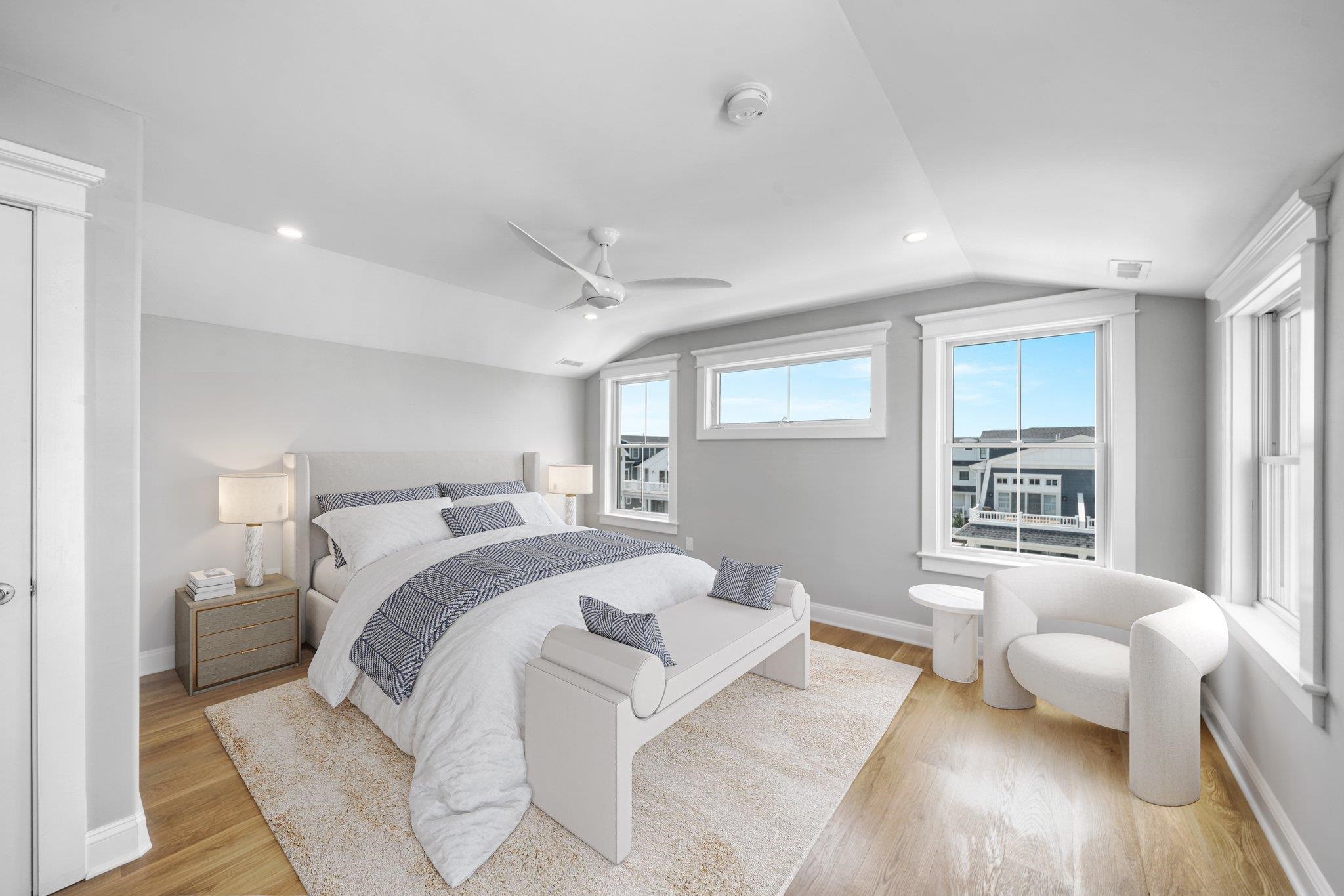 297 24th, Unit 297 Avalon, NJ 08202 - Photo 8 of 49 a bedroom with a bed and wooden floor