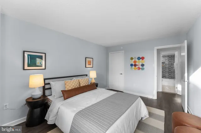 a bedroom with a bed and a couch