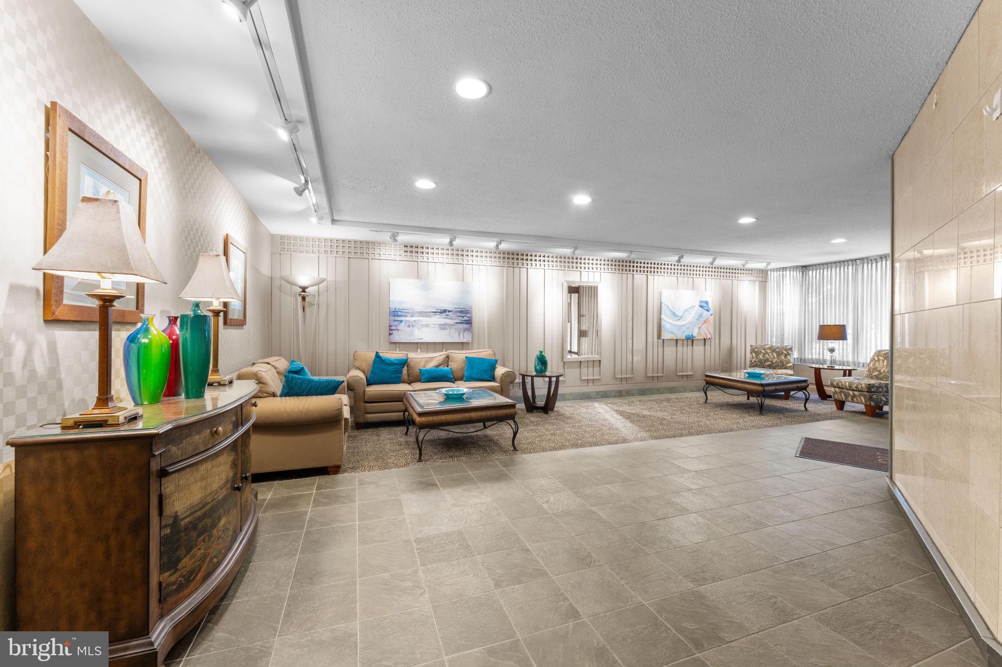 2141 P Street Northwest, Unit 306 Washington, DC 20037 - Photo 27 of 47 a room with furniture and a wooden floor