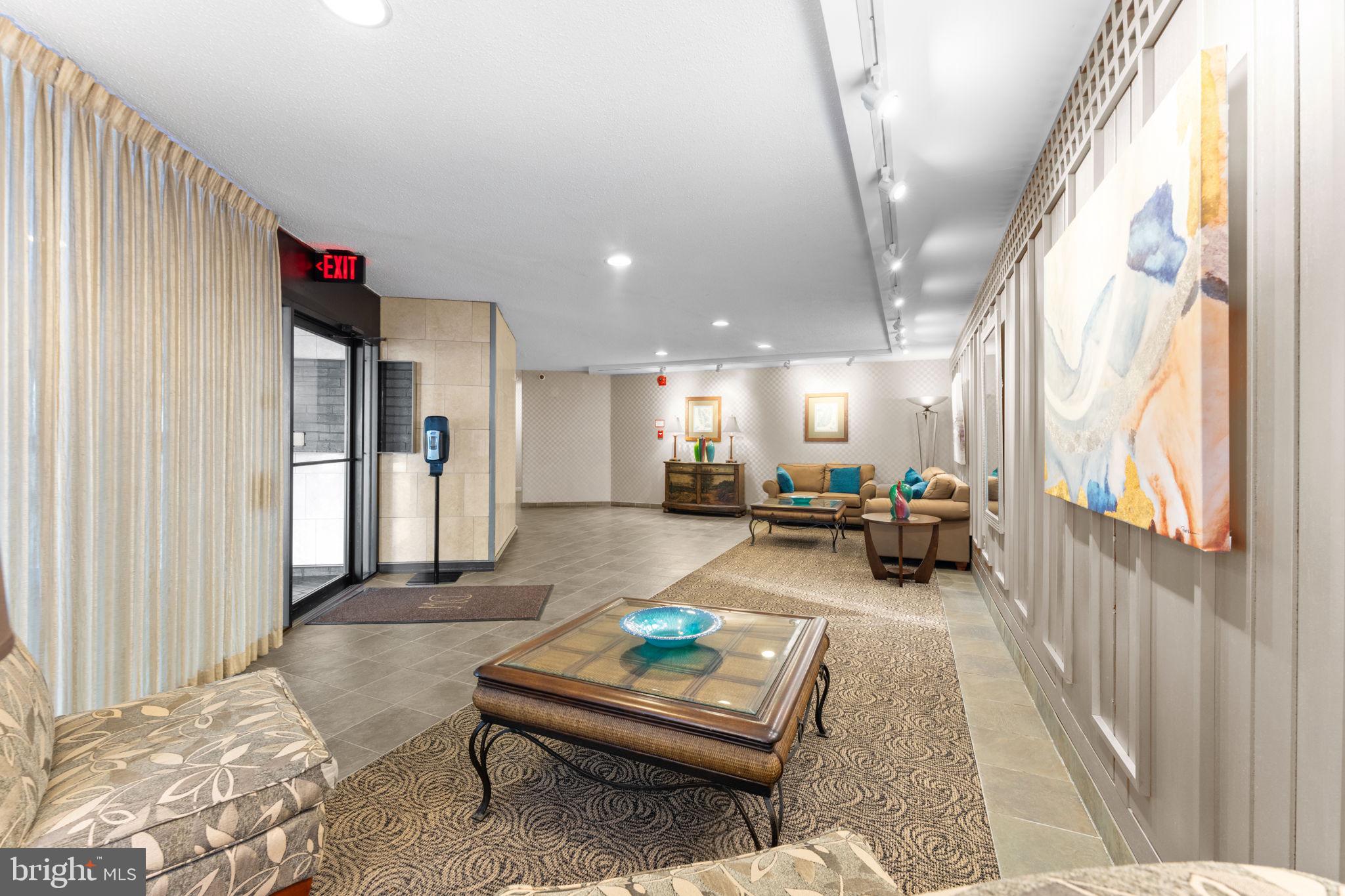 2141 P Street Northwest, Unit 306 Washington, DC 20037 - Photo 28 of 47 a living room with furniture and a table