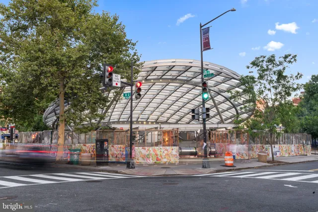 a view of a street with houses on both side