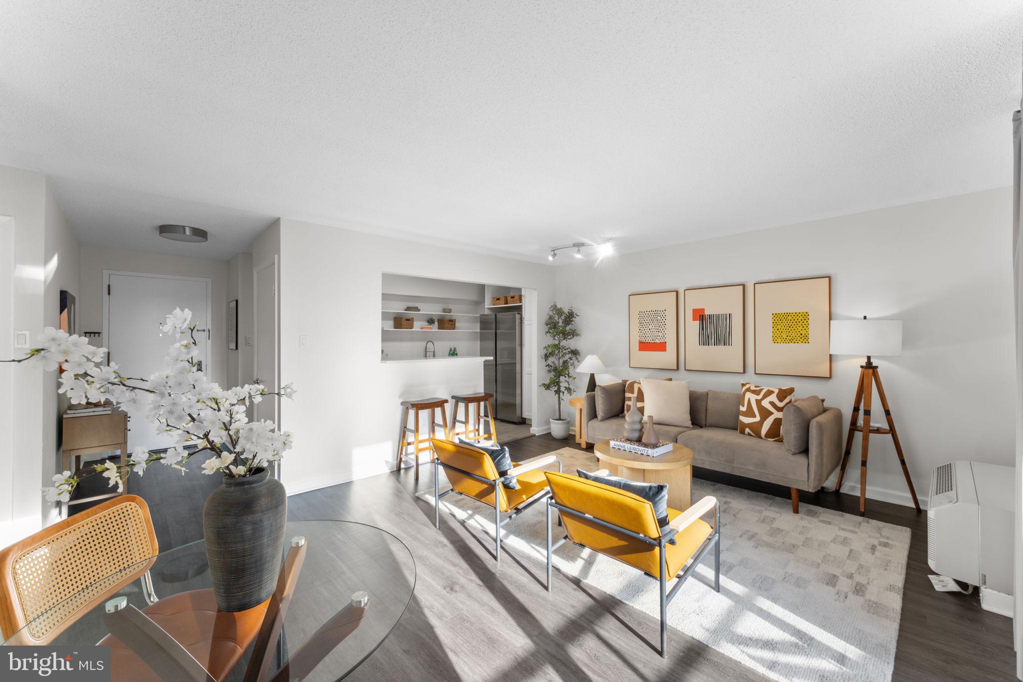 2141 P Street Northwest, Unit 306 Washington, DC 20037 - Photo 7 of 47 a living room with furniture or couch and a wooden floor