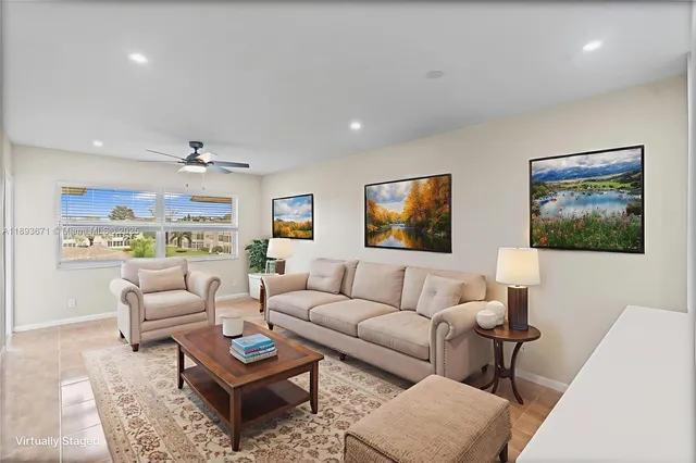a living room with furniture a rug and a painting on the wall