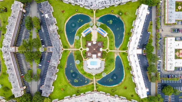a view of a swimming pool with a garden and plants