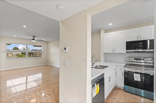 a kitchen with a stove and a refrigerator