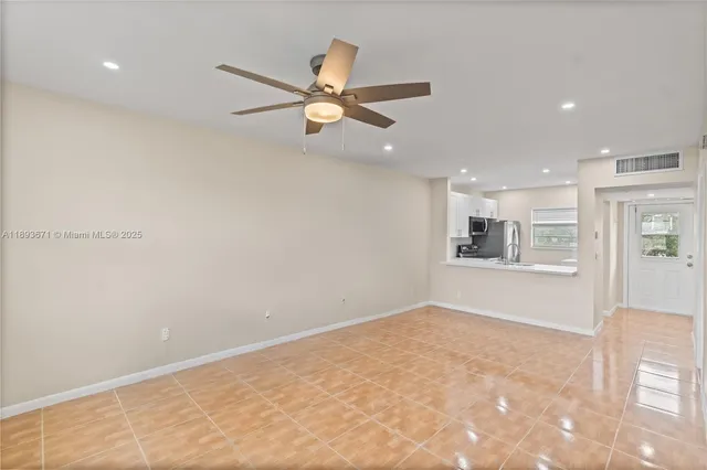 a view of an empty room and window