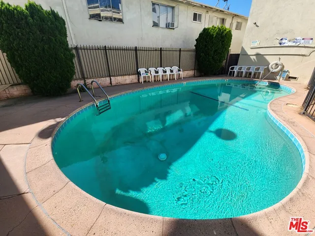 a view of a swimming pool with a garden